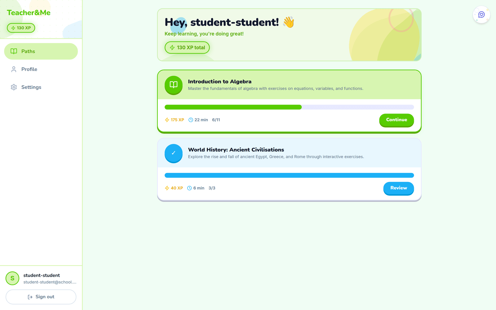 Student home screen greeting the student with total XP, and two path cards showing progress bars, XP, estimated time and Continue and Review buttons