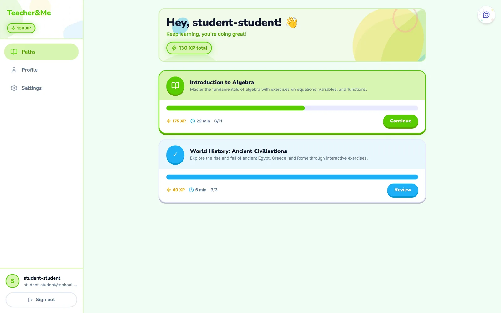 Student home screen greeting the student with total XP, and two path cards showing progress bars, XP, estimated time and Continue and Review buttons